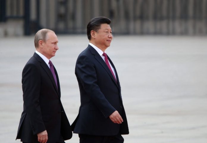 President Xi Jinping, right, sent a congratulatory message to Vladimir Putin