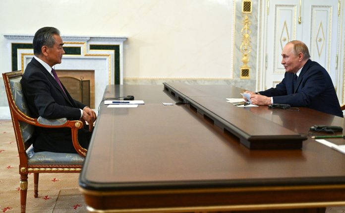 Putin with Foreign Minister of China Wang