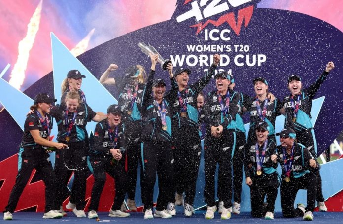 The New Zealand players celebrate with the trophy